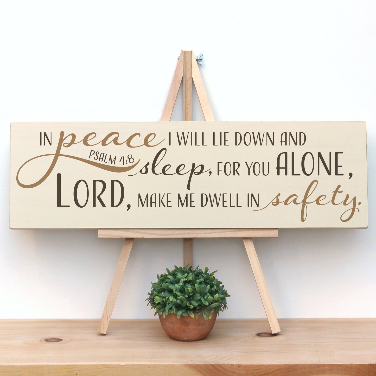 This wooden, handmade, rustic scripture sign reads, "In peace I will lie down and sleep, for you alone Lord, make me dwell in safety. Psalm 4:8"