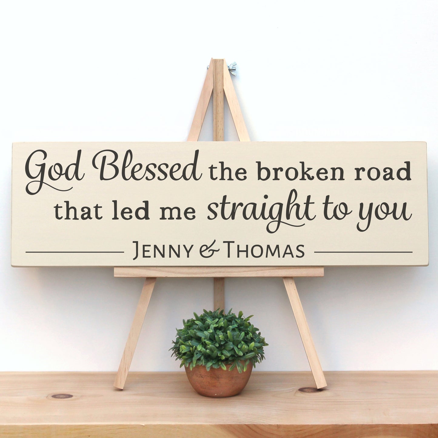Wooden Quote sign that reads, "God blessed the broken road that led me straight to you."