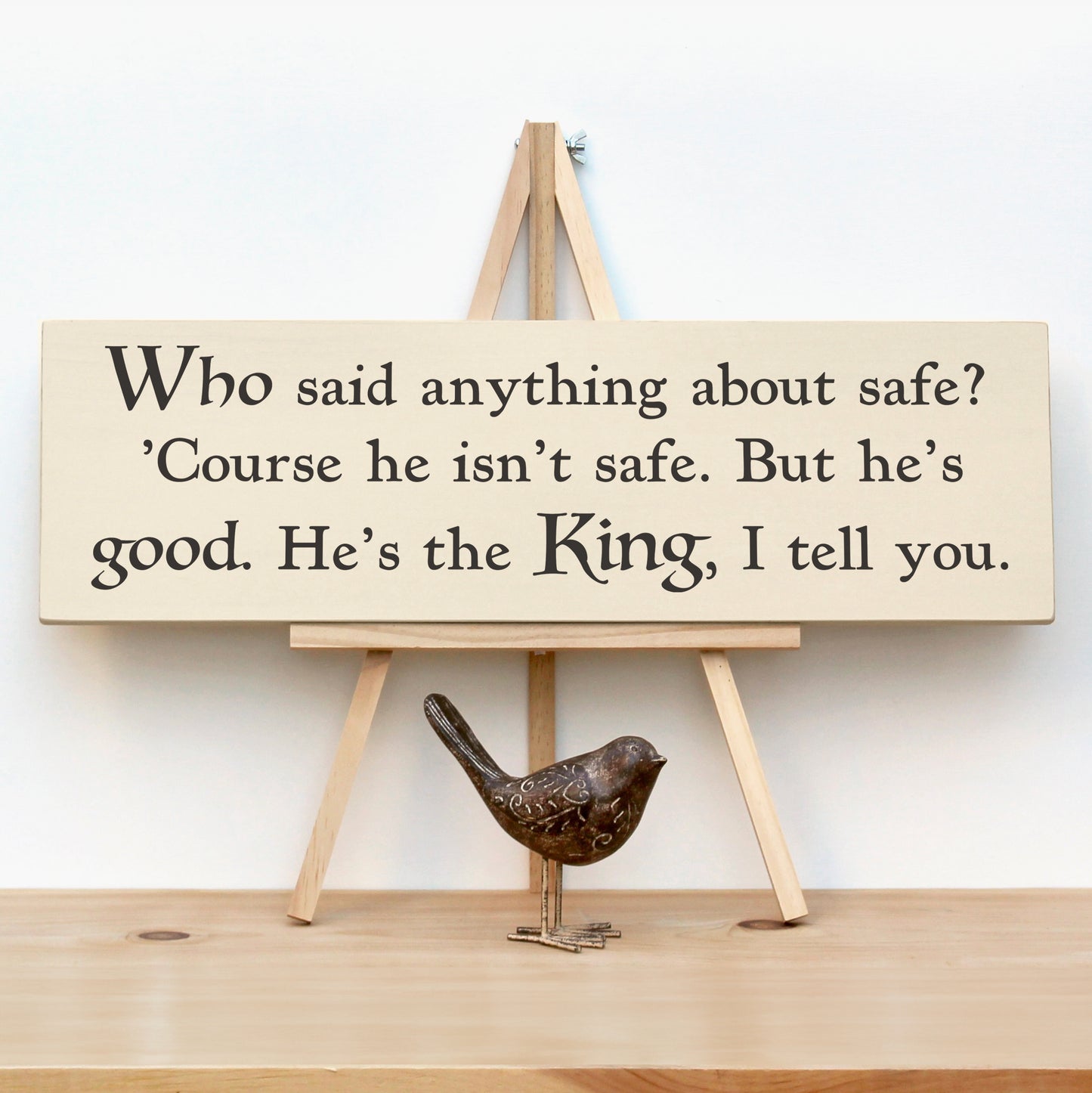 This wooden Narnia quote sign reads, "Who said anything about safe?'Course he isn't safe. But he's good. He's the King, I tell you."