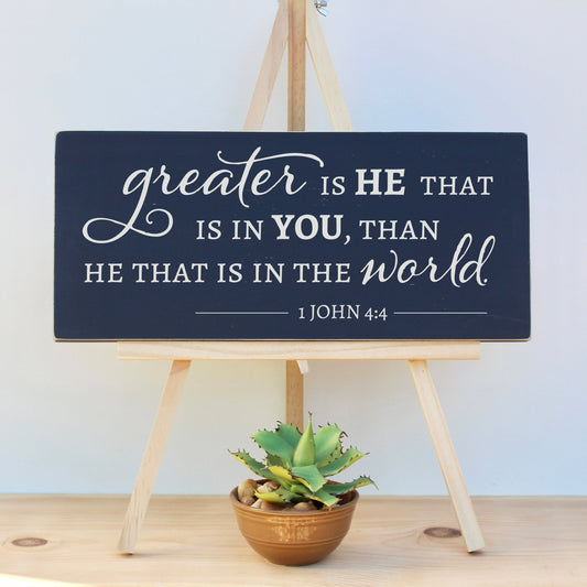 Greater is He that is in you, than he that is in the world.  1 John 4:4  Encouraging scripture sign in navy blue chalk paint.