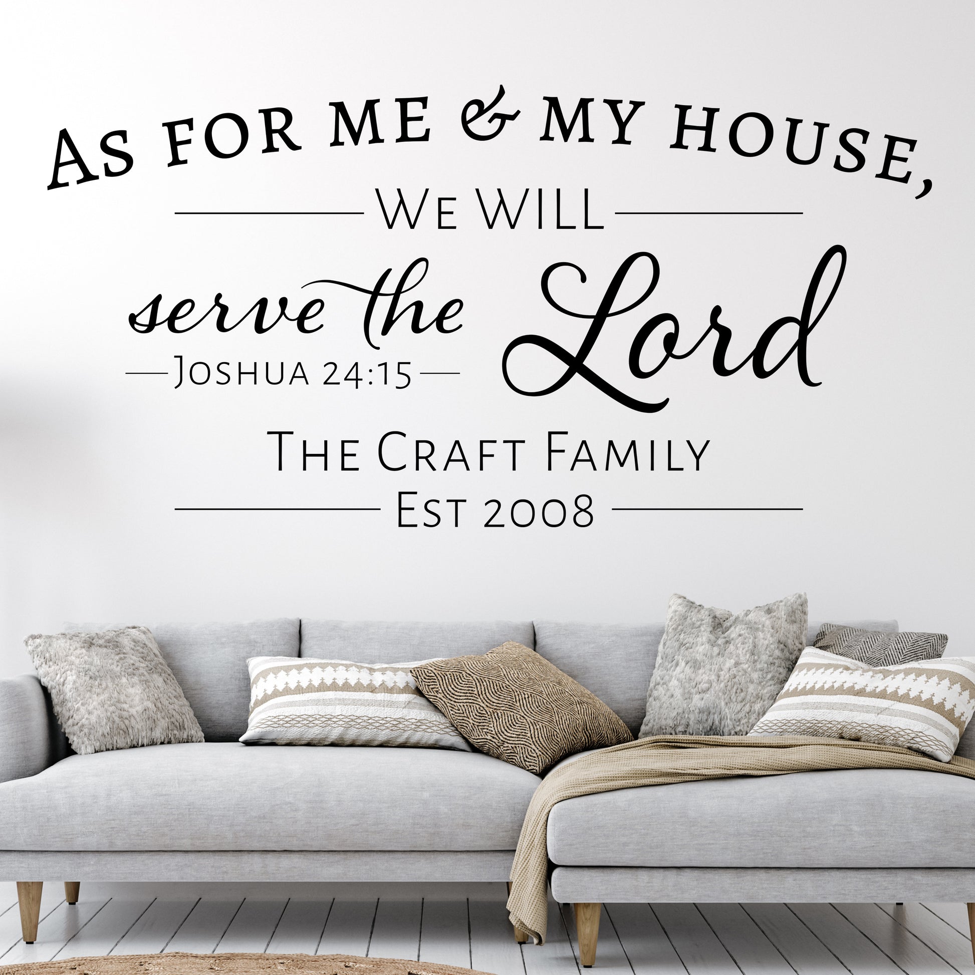 This removable wall decal for a lving room features the text, "As for me and my house, we will serve the Lord.  Joshua 24:15.   Underneath the Bible verse are a personalized family name and an established date.