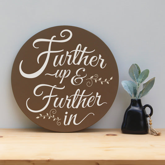 Further up and Further in round wooden Narnia quote sign.