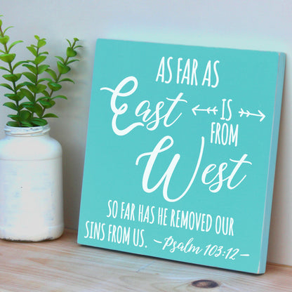 As far as the east is from the west, so far has he removed our sins from us.  Psalm 103:12.  12 X 12 inch handmade, wooden bible verse plaque.
